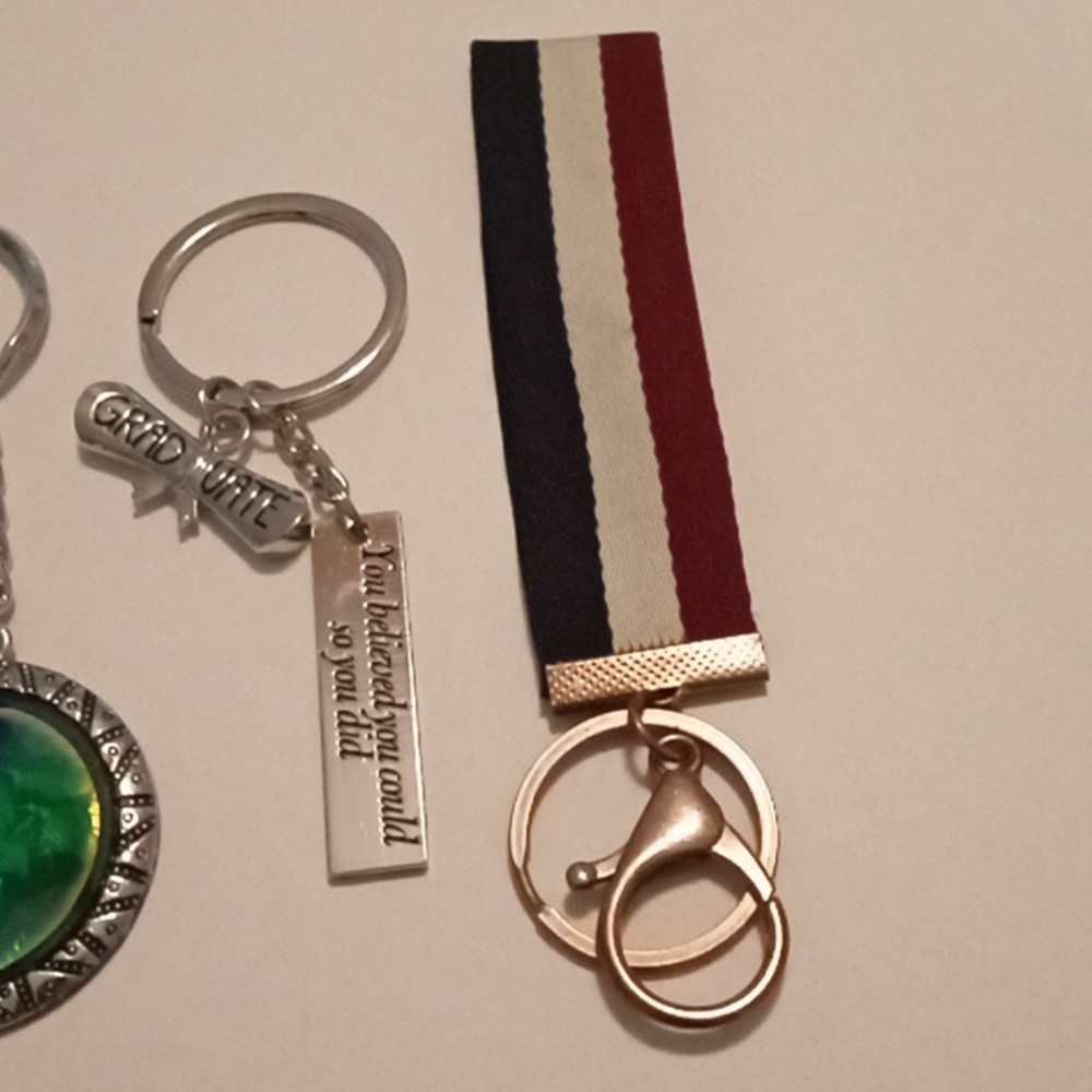 #697.  7 Piece Assorted Keychain Bundle - Picture 5 of 8